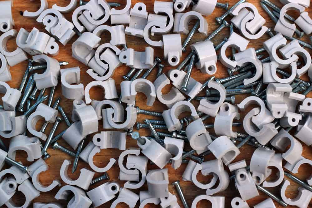 Image of white coaxial cable clips